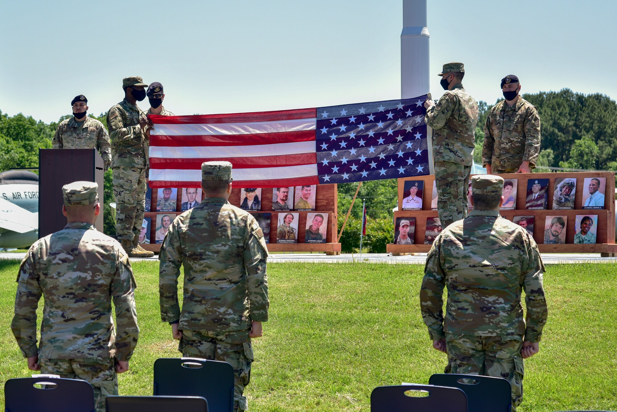 Airmen fold the American flag