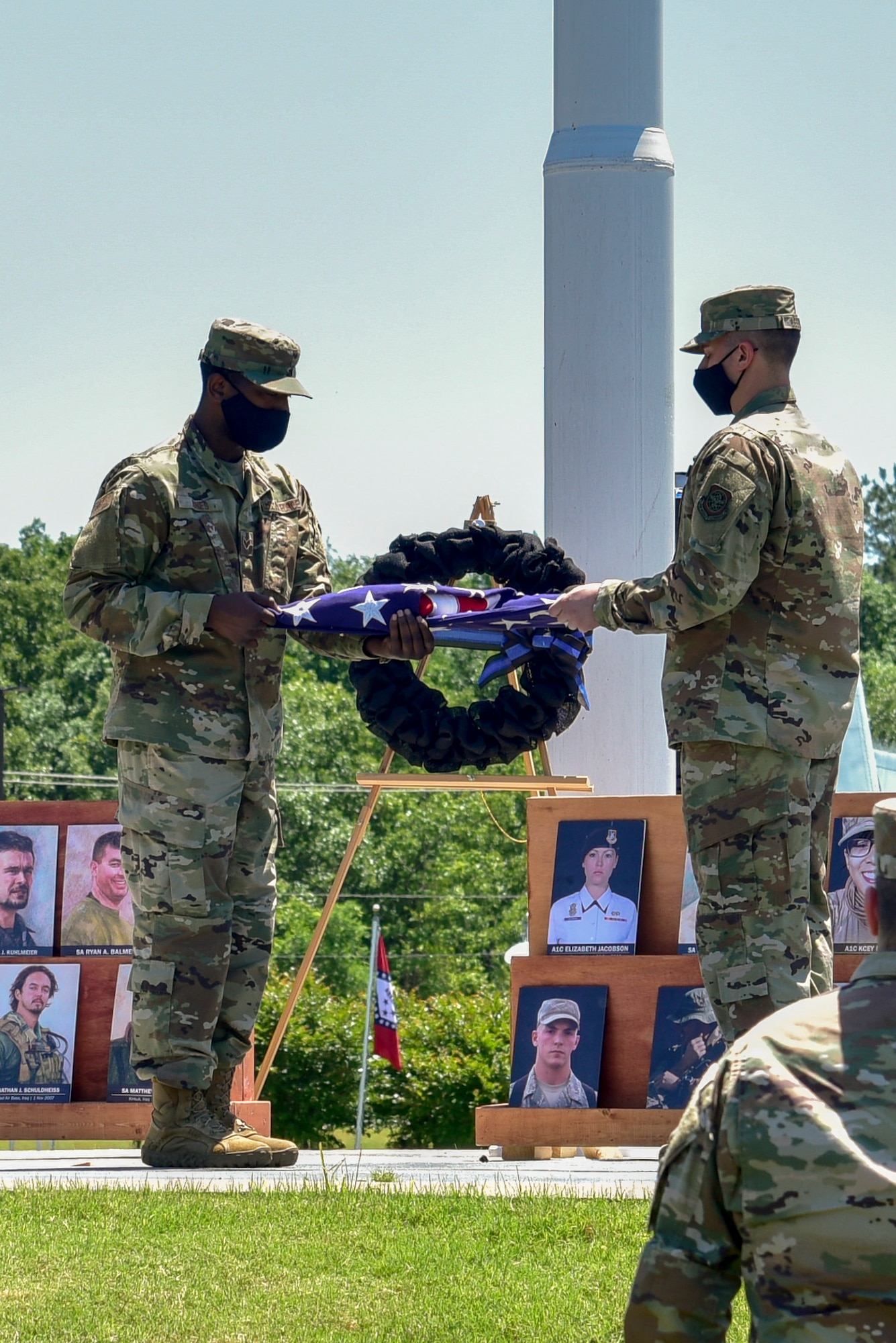 Airmen fold the American flag
