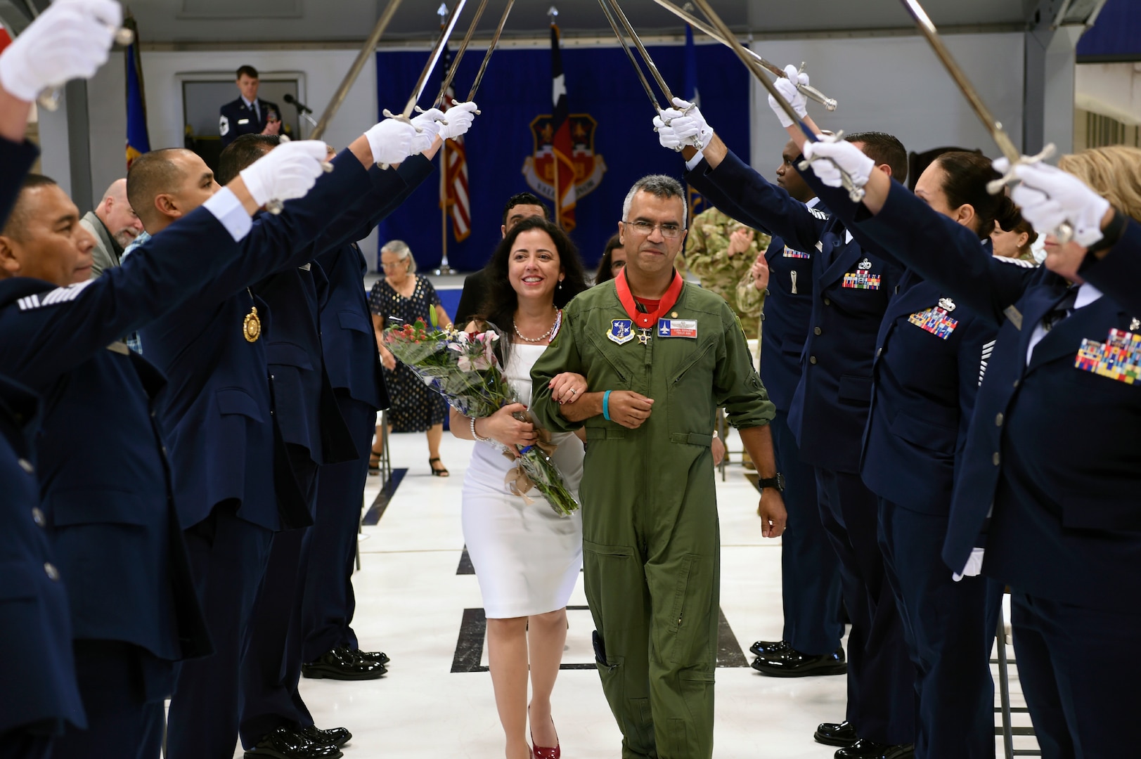 Col. Raul Rosario, the outgoing command for the 149th Fighter Wing, walks with his wife, Sheila
