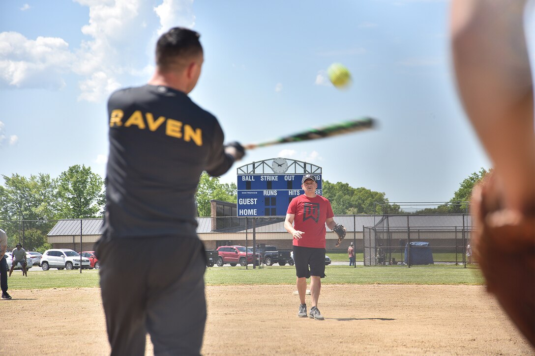 Airmen participate in a softball game during National Police Week, May 14, 2021, at Joint Base Andrews, Md. National Police Week was established by Congress in 1962 to honor members of law enforcement who lost their lives in the line of duty. JBA celebrated National Police Week with a 5k run and ruck march, security forces demonstrations, bowling, a cornhole tournament, softball games and a barbecue. (U.S. Air Force photo by Senior Airman Daniel Brosam)