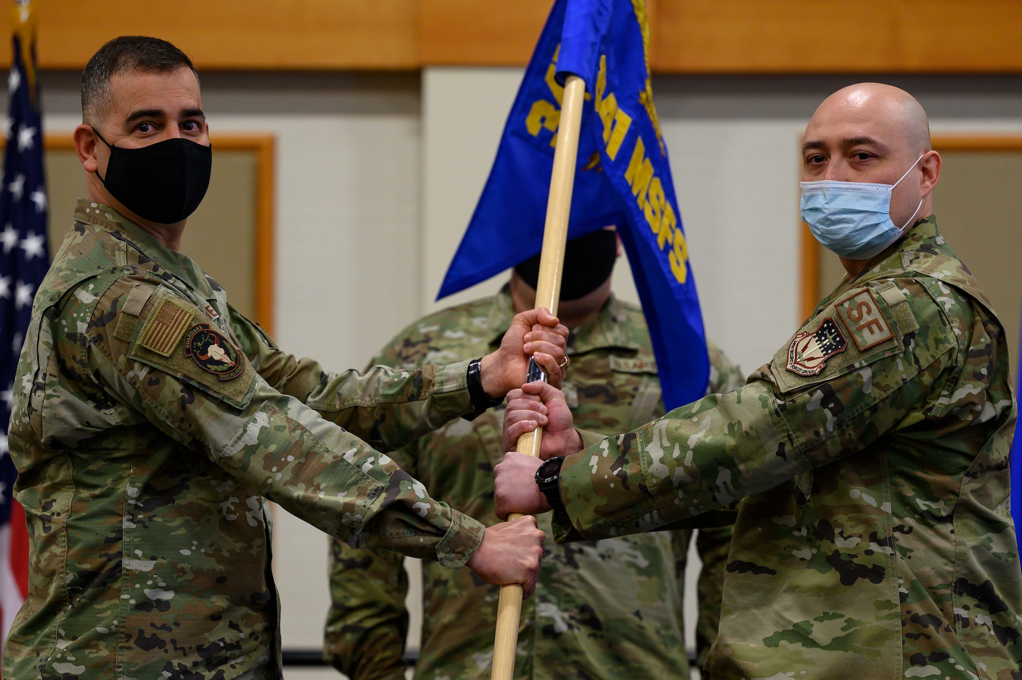 Maj. Anthony Langdon, right, accepts command of the 841st Missile Security Forces Squadron from Col. Frank Reyes, 341st Security Forces Group commander, during a change of command ceremony May 11, 2021, at Malmstrom Air Force Base, Mont.
