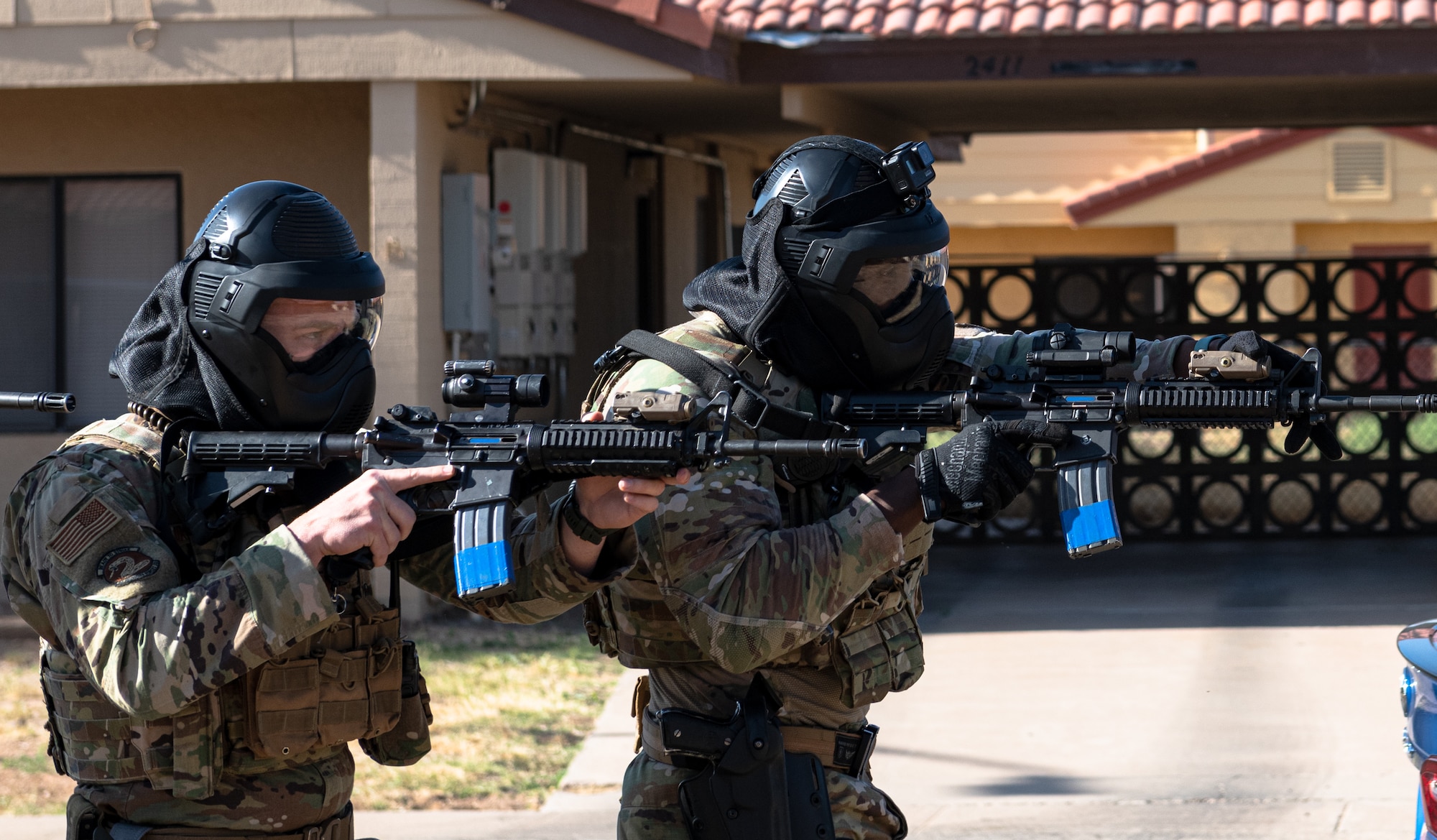 Tech. Sgt. John Cruikshank, 56th Security Forces flight sergeant (left), and Tech. Sgt. Evan Adonteng, 56th SFS noncommissioned officer in charge of operations, participate in a barricaded suspect demo May 14, 2021, at Luke Air Force Base, Arizona.