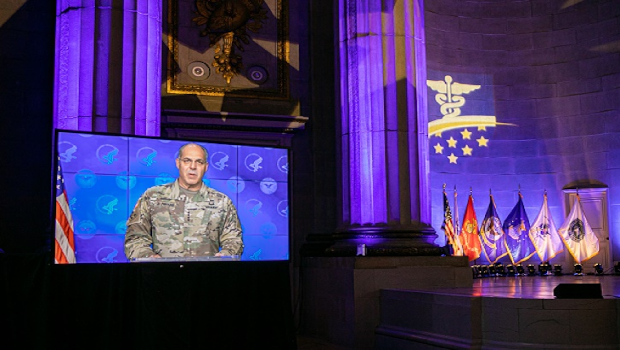 Image of a soldier talking on a television screen.