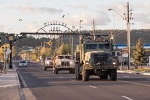 U.S. Marines drive down a street in Williams, Arizona, May 15, 2021.  Marines with 2nd Transportation Battalion, Combat Logistics Regiment 2, 2nd Marine Logistics Group conducted a convoy across the United States starting in Camp Lejeune, North Carolina and arriving at Marine Corps Air Ground Combat Center Twentynine Palms, California, in one of the longest convoys in recent Marine Corps history. (U.S. Marine Corps photo by Lance Cpl. Scott Jenkins)
