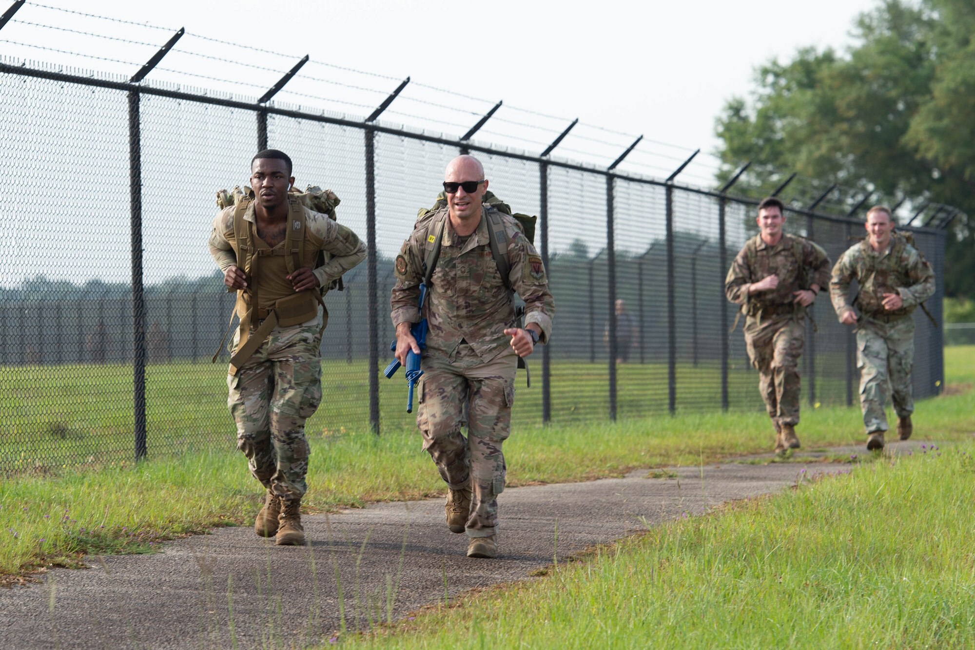 Airmen run outside.