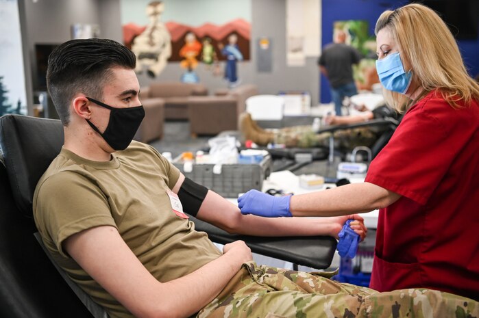 Airman 1st Class Joseph Vasquez, 367th Training Support Squadron, gets his arm swabbed by American Red Cross supervisor Dee Barfuss May 18, 2021, at the Airman Recreation Center at Hill Air Force Base, Utah. Hill Air Force Base hosts American Red Cross Blood Drives about once a month, with the next ones scheduled for June 18 and July 16 at the base's Legacy Chapel. (U.S. Air Force photo by Cynthia Griggs)