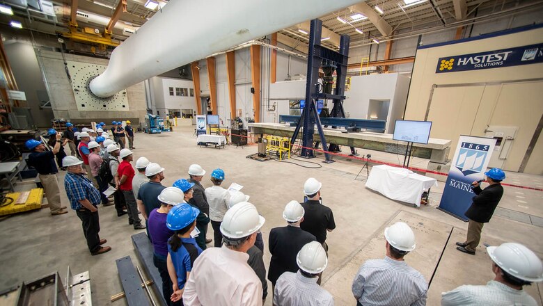 Shown is University of Maine’s full-scale structural testing of a composite material bridge girder system used for rapid construction of lightweight bridge structures.