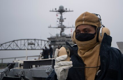 PORTSMOUTH, Va. (May 12, 2021) Aviation Ordnanceman Airman Jessica Ducksworth, from Virginia Beach, Virginia, communicates via sound-powered telephone while standing lookout watch on the flight deck of the Nimitz-class aircraft carrier USS Harry S. Truman (CVN 75) during sea and anchor detail. Truman departed Norfolk Naval Shipyard after completing a 10-month regularly scheduled extended carrier incremental availability. During the availability, the ship underwent maintenance, repair and inspection of various equipment to include engineering, combat systems, and nuclear propulsion. (U.S. Navy photo by Mass Communication Specialist 3rd Class Kelsey Trinh)