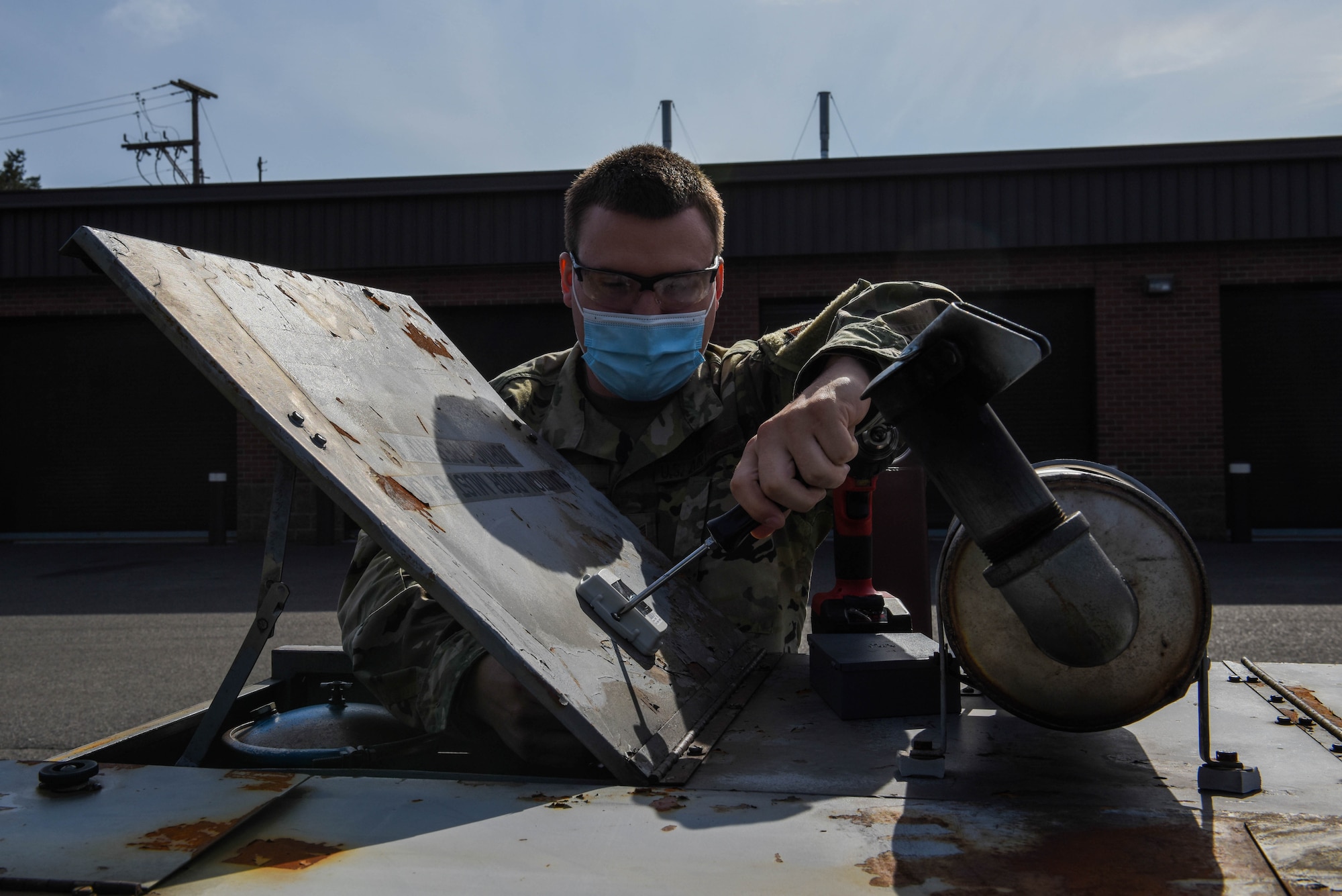 U.S. Air Force Tech. Sgt. Harley Hall, 446th Maintenance Squadron Aerospace Ground Equipment craftsman, installs a GPS tracking device to an AGE mobile generator on Joint Base Lewis-McChord, Washington, May 13, 2021. The new GPS trackers are designed to save time to keep track of AGE equipment. (U.S. Air Force photo by Senior Airman Mikayla Heineck)