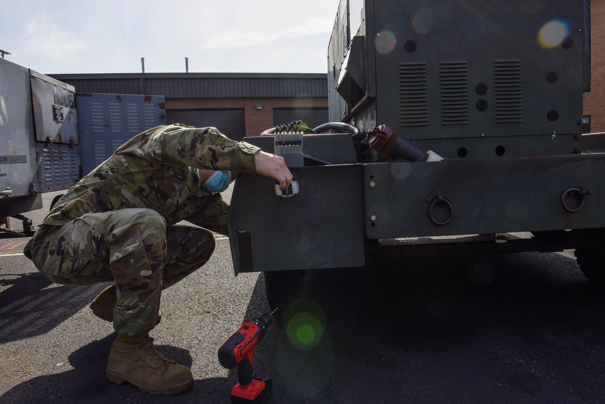 U.S. Air Force Tech. Sgt. Harley Hall, 446th Maintenance Squadron Aerospace Ground Equipment craftsman, installs a GPS tracking device to an AGE mobile generator on Joint Base Lewis-McChord, Washington, May 13, 2021. The new GPS trackers are designed to save time to keep track of AGE equipment. (U.S. Air Force photo by Senior Airman Mikayla Heineck)
