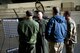 U.S. Air Force Col. David Berkland, second from left, the 354th Fighter Wing commander, talks about the wing’s aircraft growth to Adm. John Aquilino, left, the U.S. Indo-Pacific Command (USINDOPACOM) commander, Sen. Dan Sullivan, second from right, and Command Sgt. Maj. Shane W. Shorter, the USINDOPACOM command senior enlisted leader, on Eielson Air Force Base, Alaska, May 15, 2021.