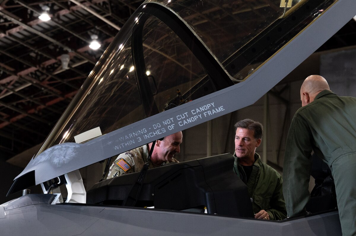 U.S. Army Command Sgt. Maj. Shane Shorter, left, the U.S. Indo-Pacific Command (USINDOPACOM) command senior enlisted leader, and Adm. John Aquilino, the USINDOPACOM commander, check an F-35A Lightning II cockpit with Air Force Col. David Berkland, the 354th Fighter Wing commander, on Eielson Air Force Base, Alaska, May 15, 2021.