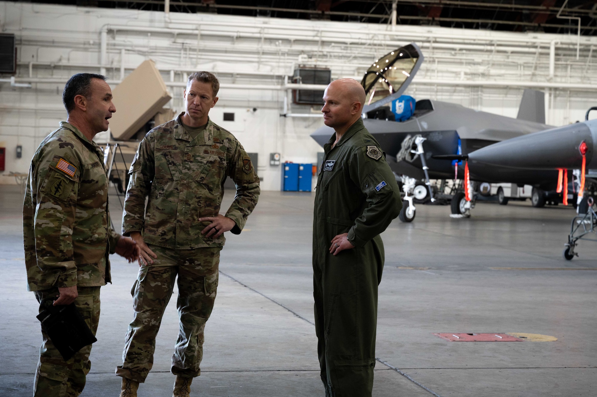 U.S. Army Command Sgt. Maj. Shane Shorter, left, the U.S. Indo-Pacific Command (USINDOPACOM) command senior enlisted leader, talks to Air Force Chief Master Sgt. John Lokken, the 354th Fighter Wing (FW) command chief, and Col. David Berkland, the 354th FW commander, during a leadership visit on Eielson Air Force Base, Alaska, May 15, 2021.
