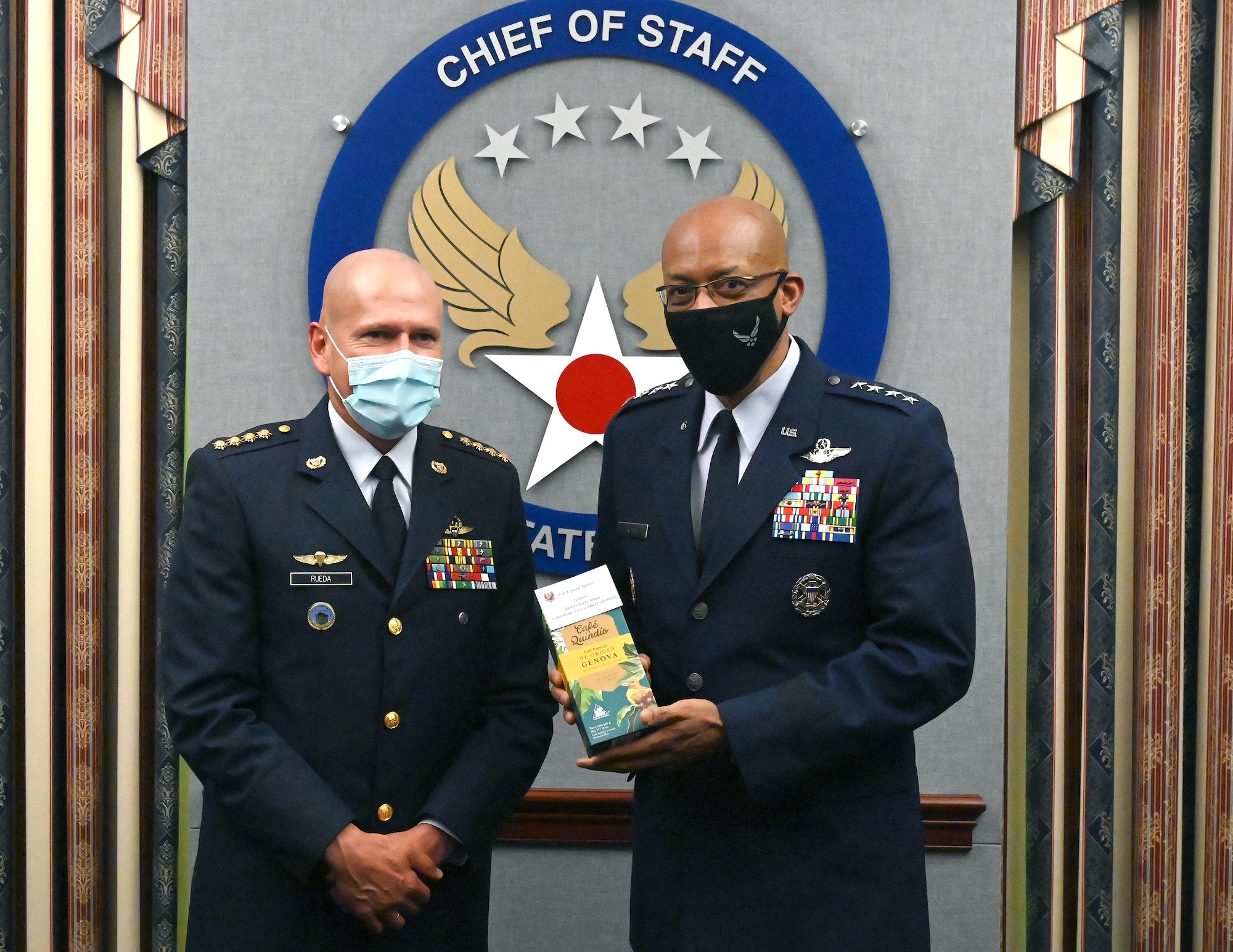 Chief of Staff of the Air Force Gen. Charles Q. Brown Jr. (right) and Gen. Ramses Rueda Rueda, commander of the Colombian air force exchange gifts