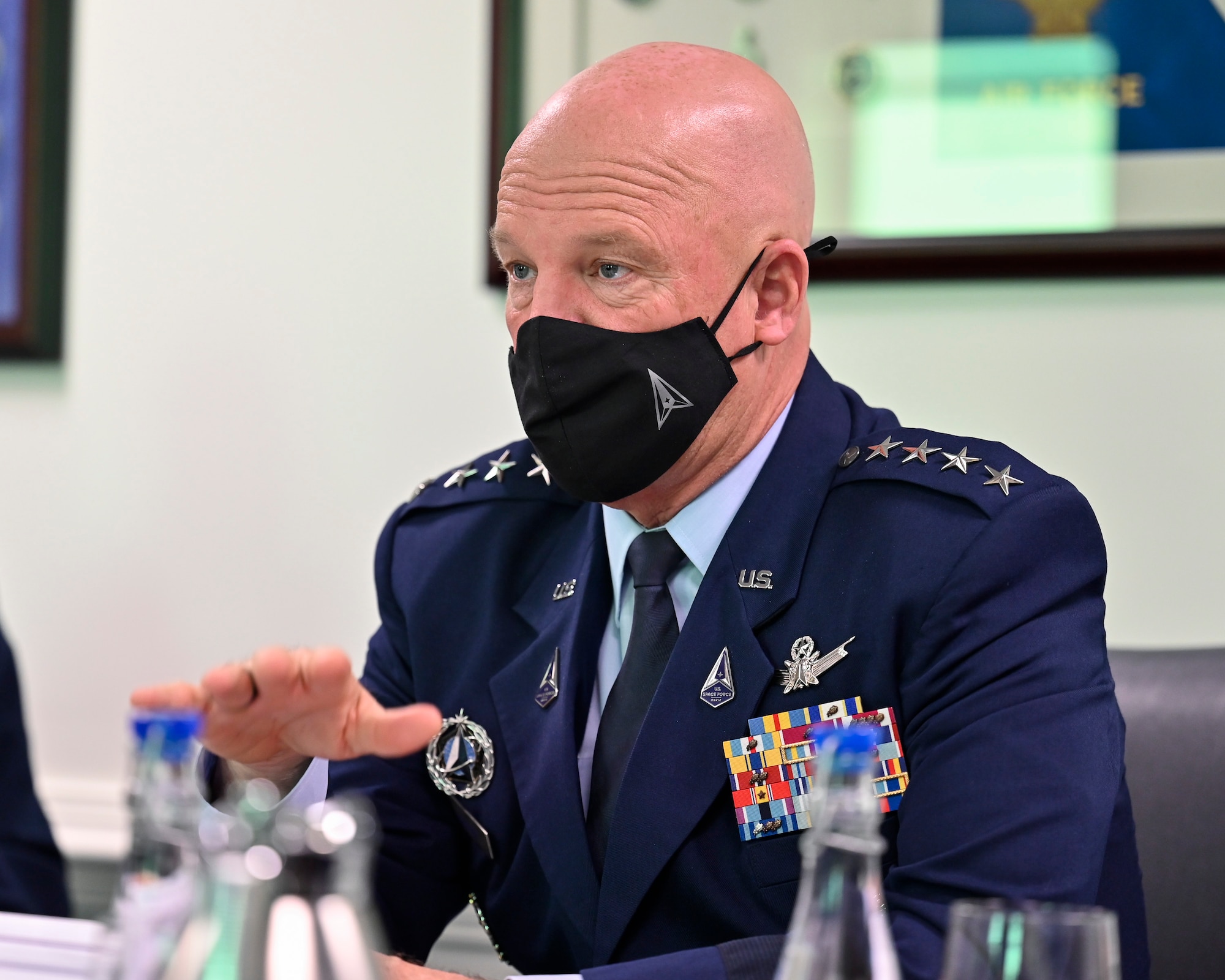 Chief of Space Operations Gen. John W. Raymond speaks with Gen. Ramses Rueda Rueda, commander of the Colombian air force, during a meeting