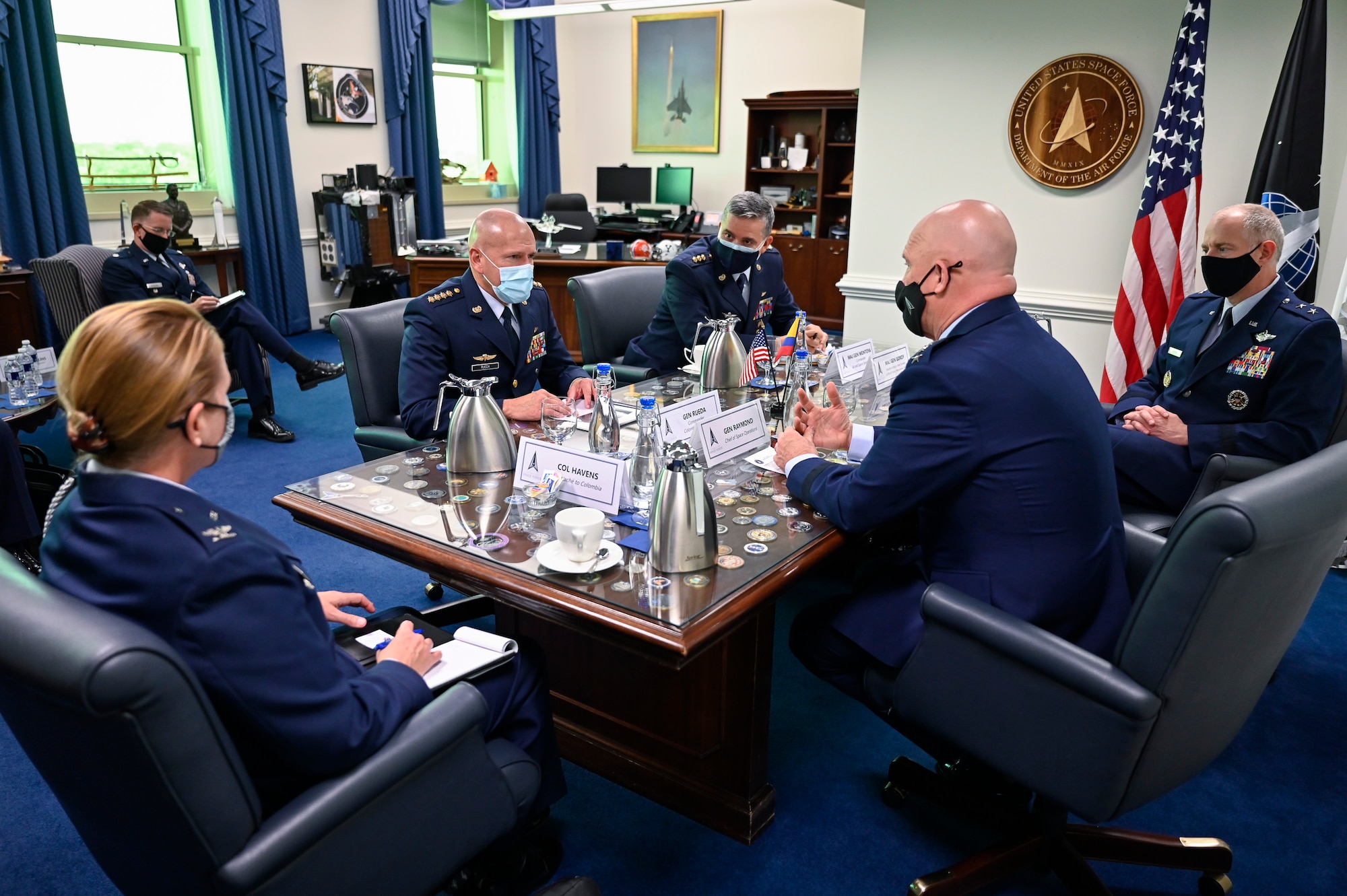 Gen. Ramses Rueda Rueda, second from left, commander of the Colombian air force, speaks with Chief of Space Operations Gen. John W. Raymond during a meeting