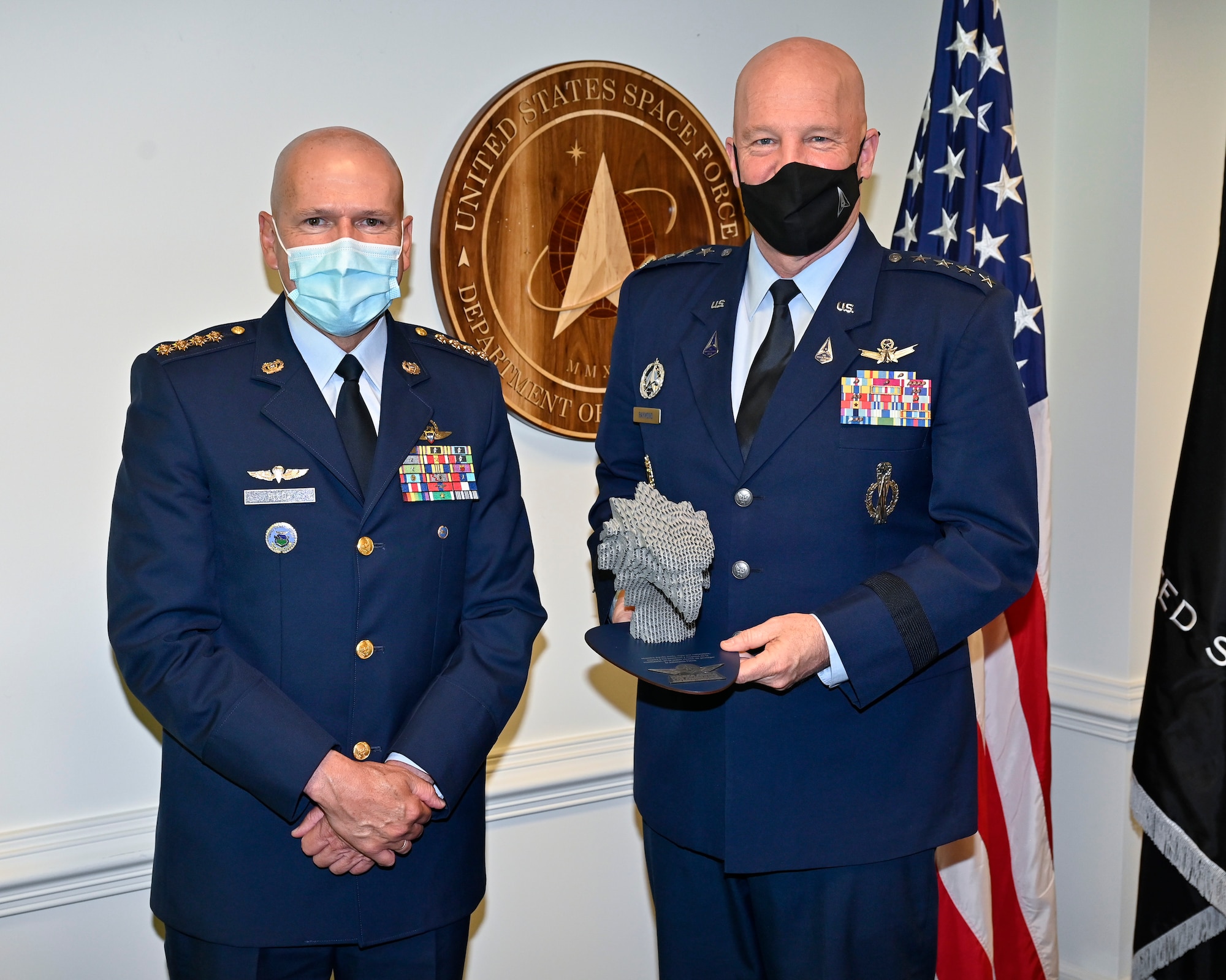 Chief of Space Operations Gen. John W. Raymond, right, poses with Gen. Ramses Rueda Rueda, commander of the Colombian air force