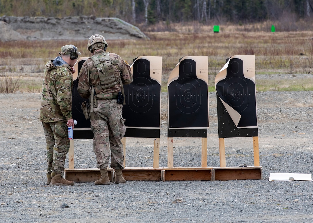 Alaska National Guard Soldiers and Airmen compete amongst one another in a series of marksmanship events at Joint Base Elmendorf-Richardson, May 15, 2021, as part of the 2021 Alaska National Guard Adjutant General Match, or TAG Match. TAG Match is a marksmanship competition comprising several timed pistol and rifle events. (U.S. Army National Guard photo by Spc. Jacob Stone)