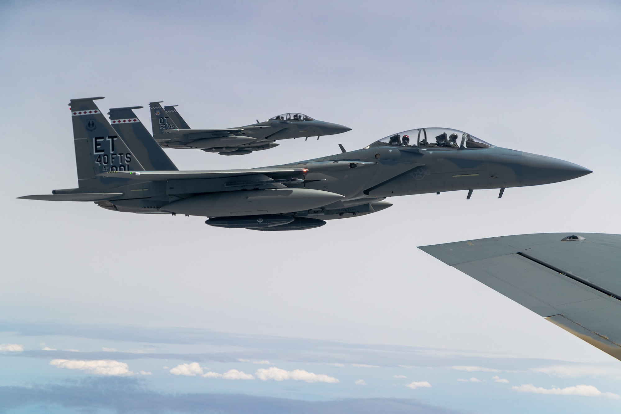 F-15EX Eagle II’s from the 40th Flight Test Squadron, 96th Test Wing, and the 85th Test and Evaluation Squadron, 53rd Wing, both out of Eglin Air Force Base, Florida, fly in formation during aerial refueling operations with a KC-135 Stratotanker from the 370th Flight Test Squadron out of Edwards Air Force Base, California, May 14. The Eagle II participated in the Northern Edge 21 exercise in Alaska earlier in May. (Air Force photo by Ethan Wagner)