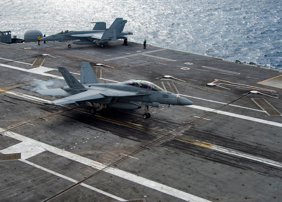 An F/A-18F Super Hornet, attached to the "Red Rippers" of Strike Fighter Squadron (VFA) 11, lands on the flight deck of the Nimitz-class aircraft carrier USS Harry S. Truman (CVN 75) during carrier qualifications after completing an extended incremental availability.