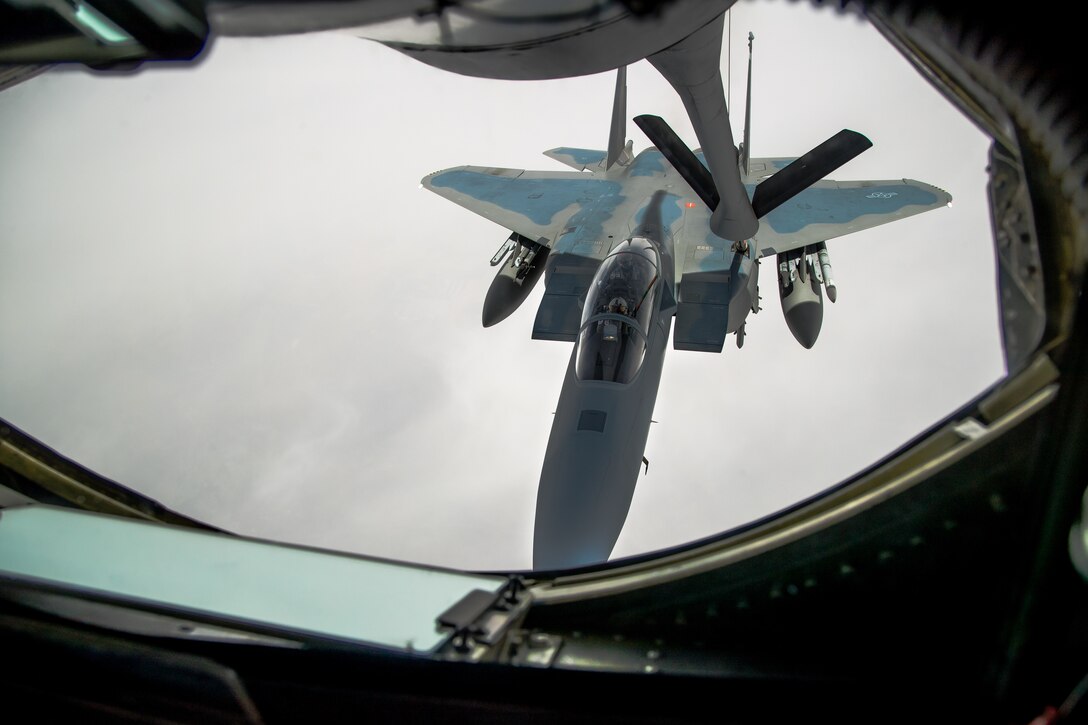An F-15EX Eagle II from the 40th Flight Test Squadron, 96th Test Wing out of Eglin Air Force Base, Florida, flies in formation during an aerial refueling maneuver with a KC-135 Stratotanker from the 370th Flight Test Squadron out of Edwards Air Force Base, May 14. The Eagle II participated in the Northern Edge 21 exercise in Alaska earlier in May. (Air Force photo by Ethan Wagner)