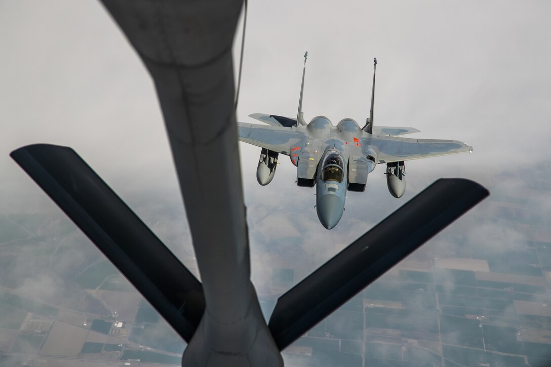 An F-15 from the 85th Test and Evaluation Squadron, 53rd Wing, out of Eglin Air Force Base, Florida, conducts aerial refueling operations with a KC-135 Stratotanker from the 370th Flight Test Squadron out of Edwards Air Force Base, above the skies of Northern California, May 14. The aircraft participated in the Northern Edge 21 exercise in Alaska earlier in May. (Air Force photo by Ethan Wagner)