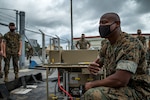 A U.S. Marine instructs Marines on the Expeditionary Mobile Fuel Additization on Camp Hansen, Okinawa, Japan, May 12.