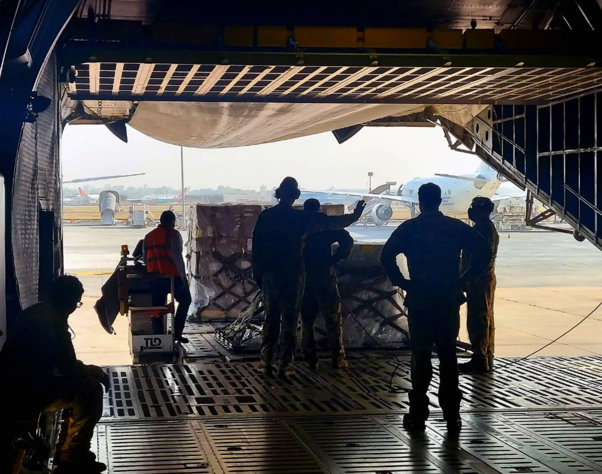 Reserve Citizen Airmen with the 433rd Airlift Wing from Joint Base San Antonio-Lackland work with ground crews at the airport in New Delhi, India.