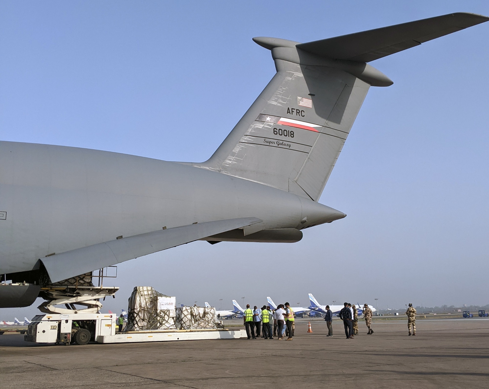 Ground crews offload COVID-19 medical treatment supplies from a 433rd Airlift Wing C-5M Super Galaxy.