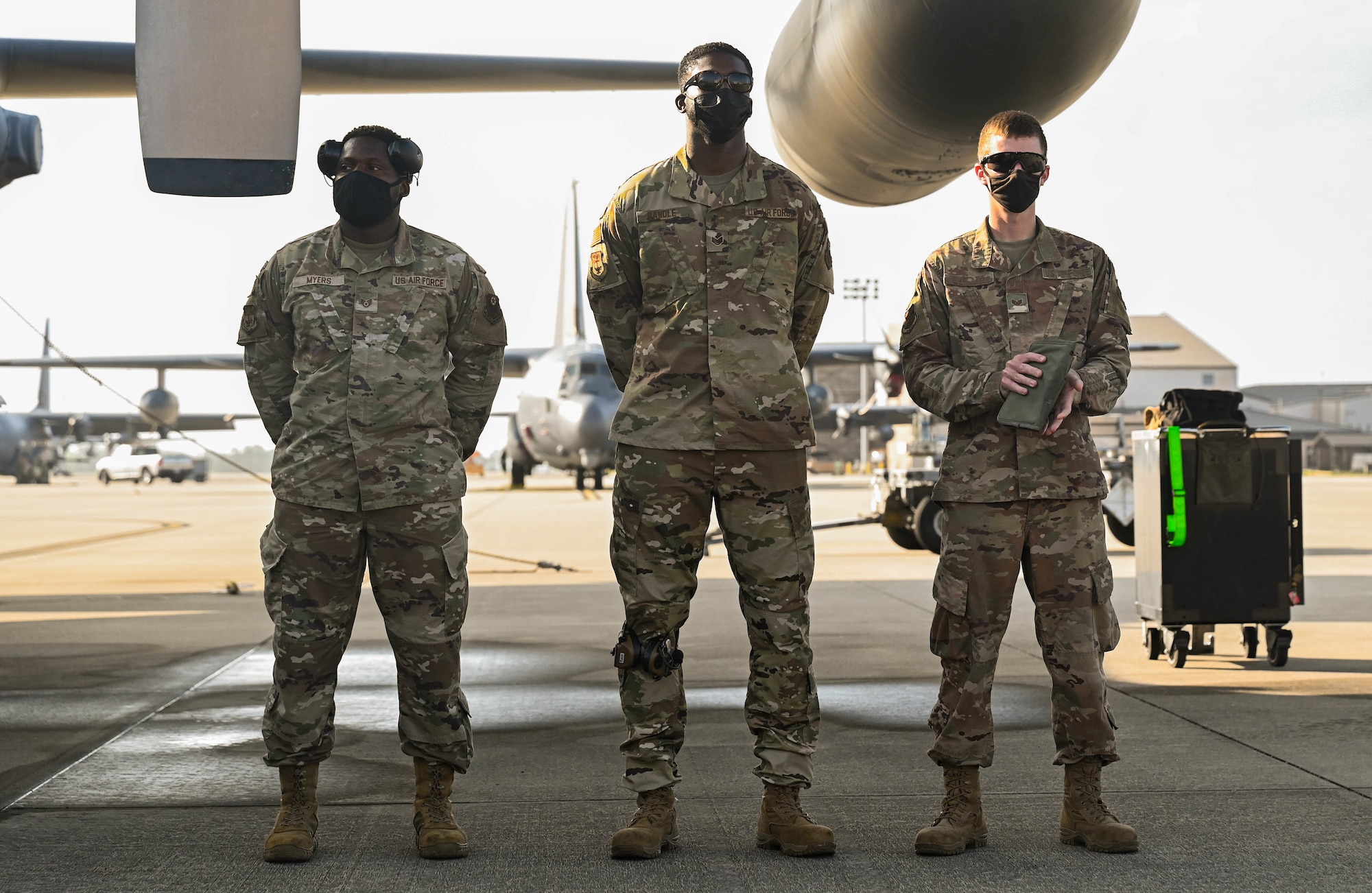 U.S. Air Force Staff Sgt. Mackie Myers, Staff Sgt. Jimmy Randle, and Staff Sgt. Dustin Eveland, left to right, with the 1st Special Operations Maintenance Group, evaluate competitors during a load competition.