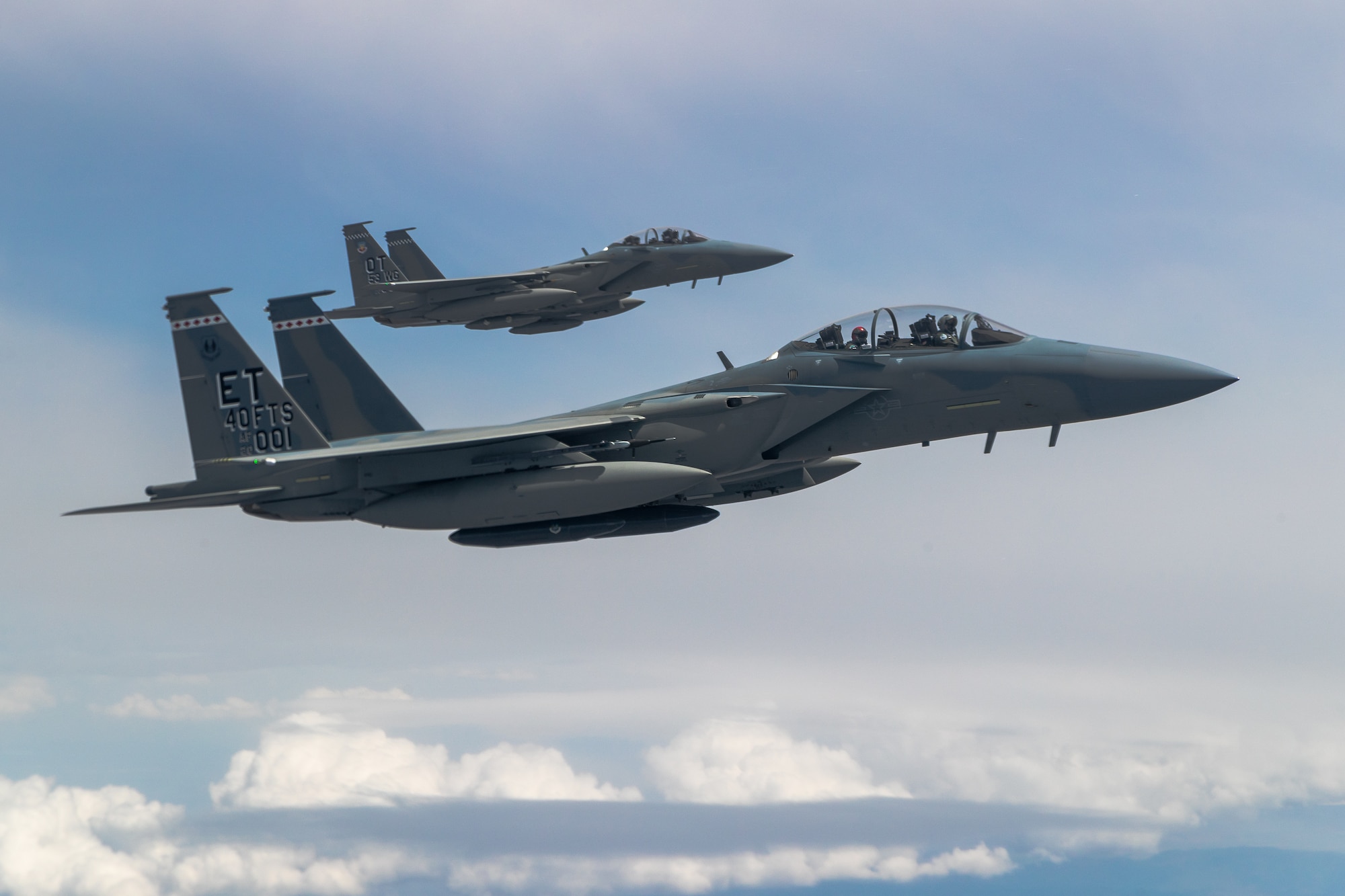 F-15EX Eagle II’s from the 40th Flight Test Squadron, 96th Test Wing, and the 85th Test and Evaluation Squadron, 53rd Wing, both out of Eglin Air Force Base, Florida, fly in formation during an aerial refueling operation over Northern California. The aircraft participated in the Northern Edge 21 exercise in Alaska earlier in May. (Air Force photo by Ethan Wagner)