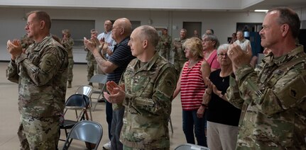 Guests applaud for Soldiers assigned to Task Force Mansfield at the end of the task force’s sendoff ceremony May 18, 2021, at Camp Colchester, Vermont. The task force will deploy to the U.S. European Command area of operations for about one year.