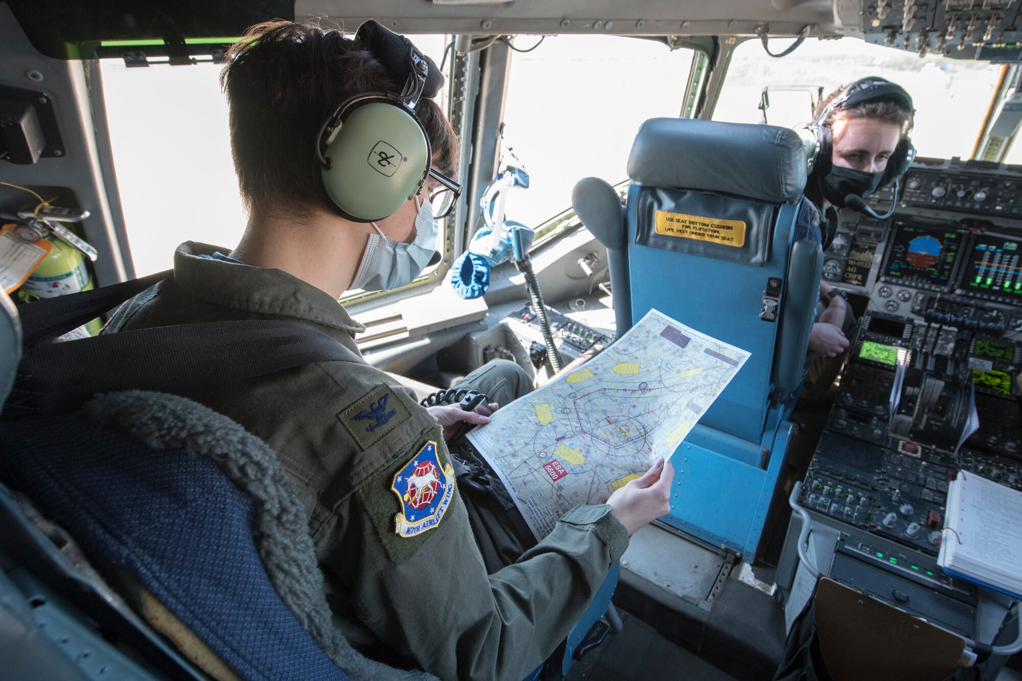 Hunter Willis views the flight path of the aircraft before taking off on a training flight during a commander for the day event at the 167th Airlift Wing, Martinsburg, West Virginia, May 13, 2021. Willis, a local area resident diagnosed with a terminal illness, was invited to the 167th to serve as the wing commander for the day. After he was sworn in as commander, Willis was mission briefed, flown on a C-17 Globemaster III aircraft training mission and promoted his father, Tom Willis, to Lieutenant Colonel. (U.S. Air National Guard photo by Senior Airman Edward Michon).