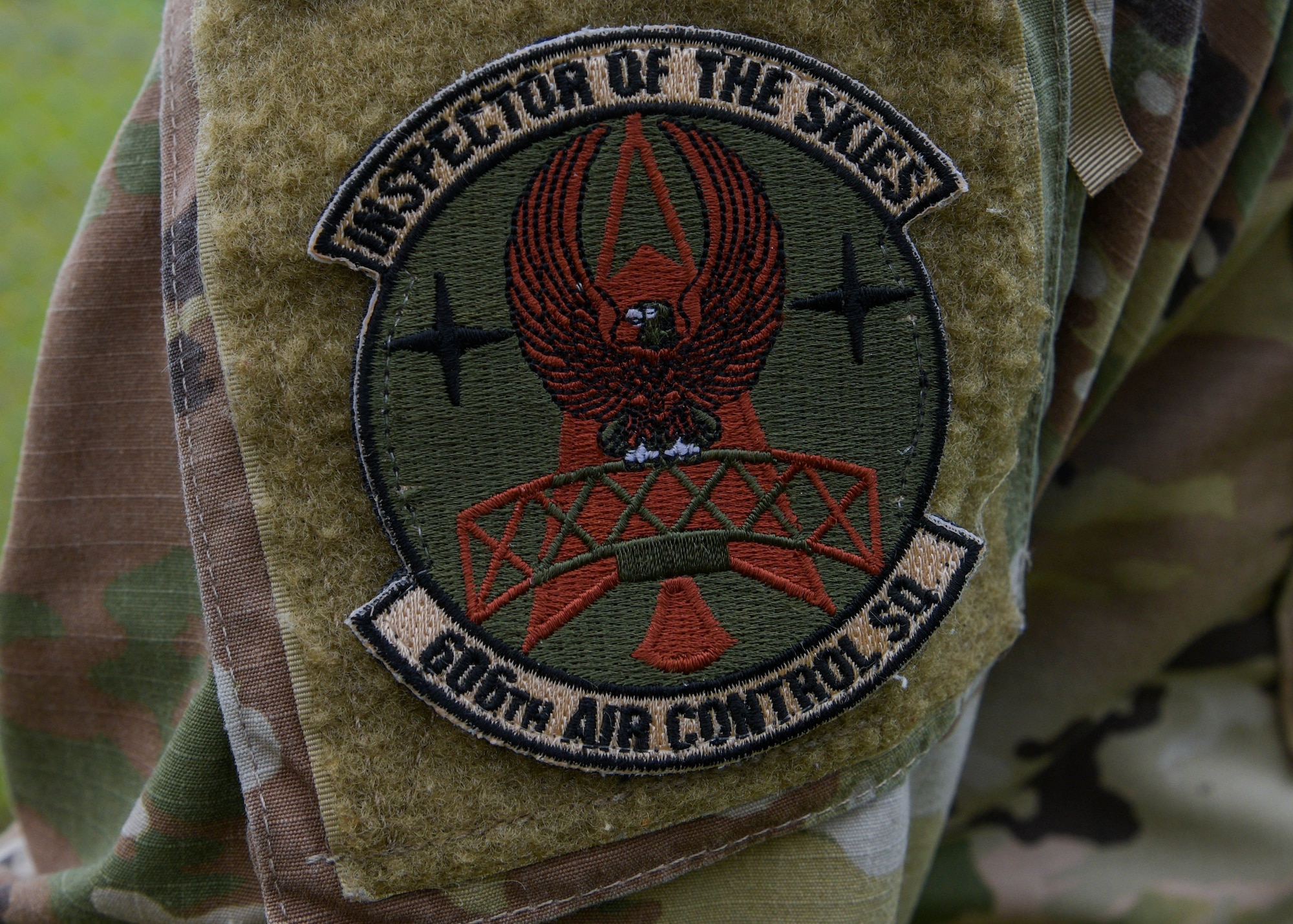 Tech. Sgt. Timothy Puente, 606th Air Control Squadron (ACS) tactical satellite communication (SATCOM) production supervisor, wears 606th Air Control Squadron patch at Aviano Air Base, Italy, May 17, 2021. The 606th Air Control Squadron, call sign “Primo,” is the U.S. Air Force’s only Control and Reporting Center outside the continental United States, and provides tactical command and control. (U.S. Air Force photo by Airman 1st Class Brooke Moeder)