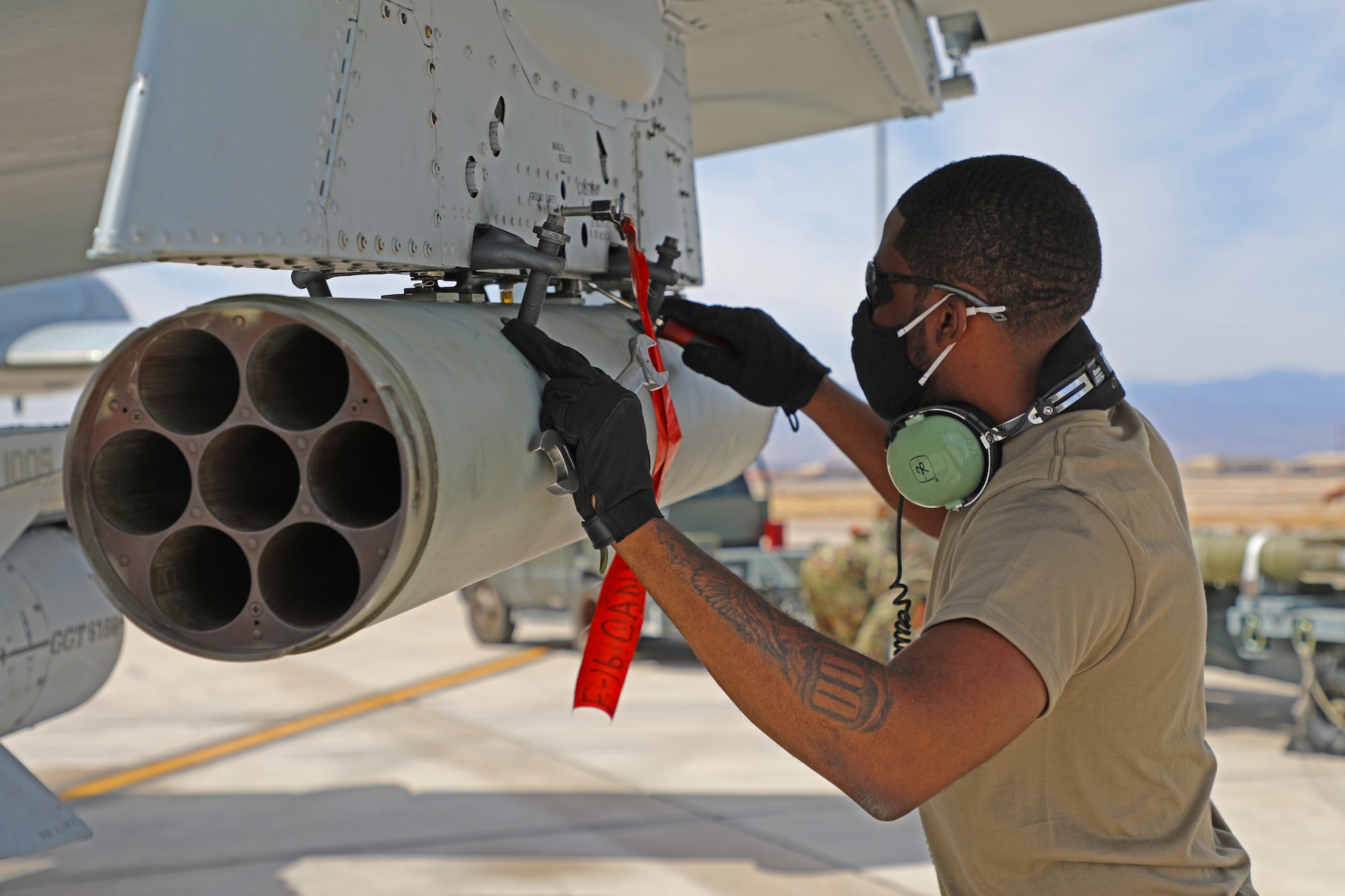 Master Sgt. Joe Mack, from the 127th Wing Maintenance Group, loads rockets on to an A-10 Thunderbolt II at Nellis Air Force Base, Nev., April 9, 2021. Airmen from the 127th Wing are participating in Green Flag, a Joint Force combat exercise, to ensure maximum combat readiness. (U.S. Air National Guard photo by Staff Sgt. Drew Schumann)