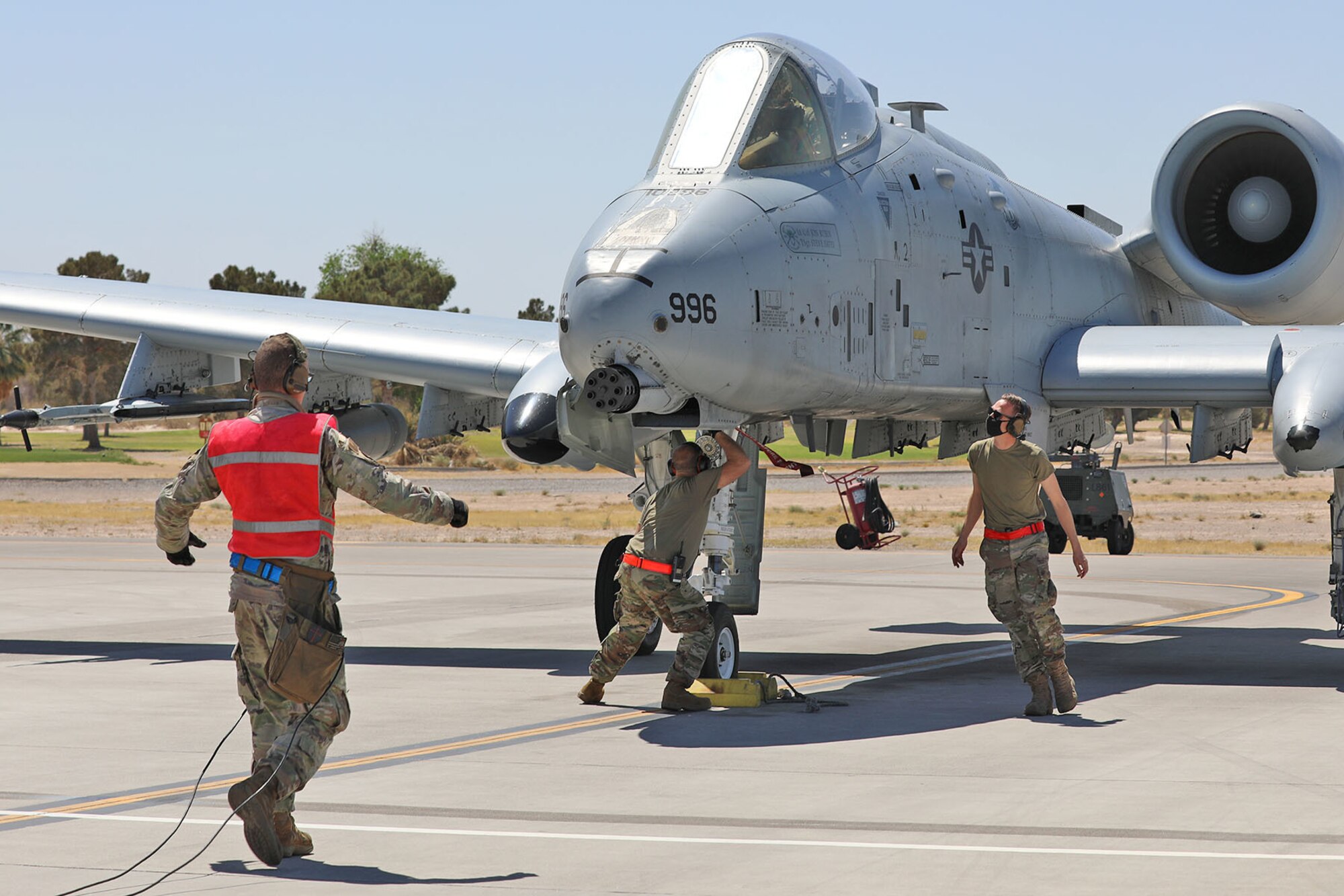 Crew chiefs with the Michigan Air National Guard’s 127th Maintenance Group, 127th Wing, prepare an A-10 Thunderbolt II aircraft for flight, during a training mission at Nellis Air Force Base, Nevada, April 12, 2021. Airmen from the 127th Wing are participating in Green Flag-West, a Joint Force combat exercise, to ensure maximum combat readiness. (U.S. Air National Guard photo by Staff Sgt. Drew Schumann)