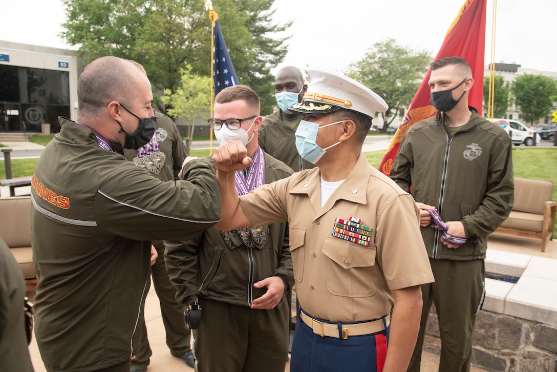 Wounded, ill and injured Marines participate in a closing ceremony for the 11th annual Marine Corps Trials.