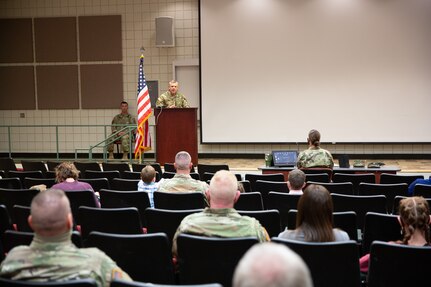 Soldier give speech behind podium
