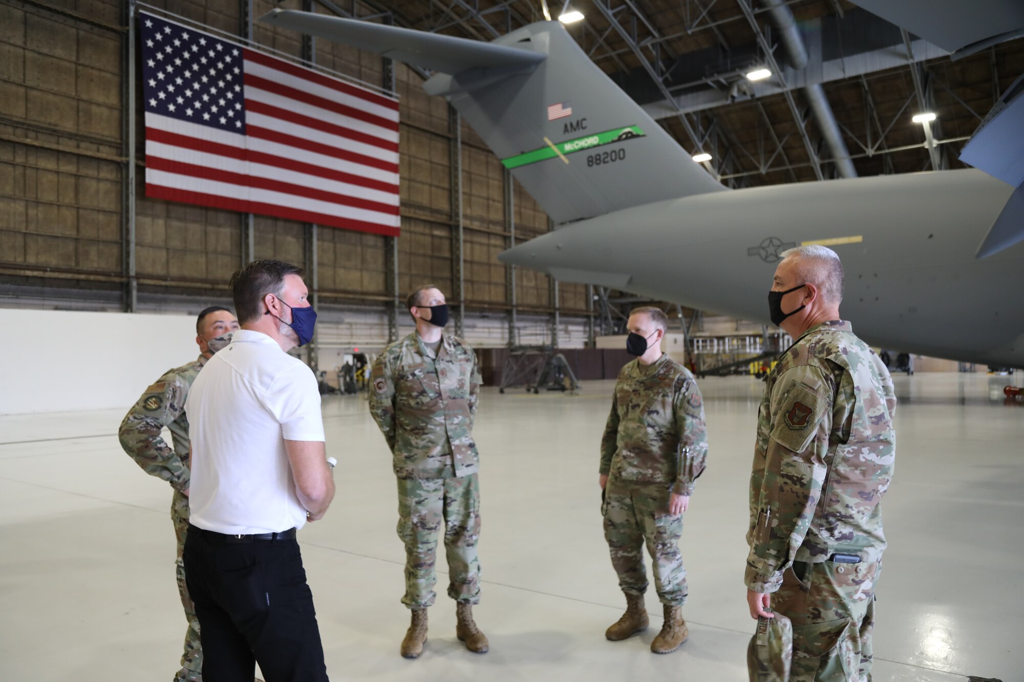 Members of the 446th Maintenance Group discuss C-17 Globemaster III aircraft specifications and maintenance with Mayor Andy Ryder, city of Lacey, Washington, during a visit to the 446th Airlift Wing on May 10, 2021 at Joint Base Lewis-McChord.