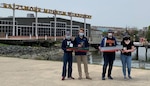 Michael Grube (left), with his little brother, holds the winning cargo ship next to Connor Merrill and Kendall Marx’s strong second place cargo ship on the right at the Maryland Engineering Challenges competition on April 24, 2021, in Baltimore.