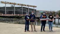 Michael Grube (left), with his little brother, holds the winning cargo ship.