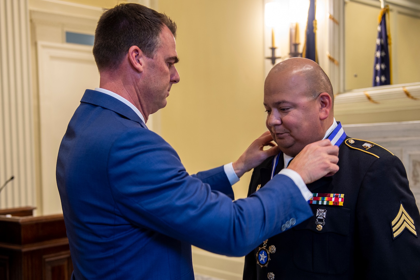 Governor Kevin Stitt presents Oklahoma Army National Guard Sgt. Pedro Gonzales III with the inaugural Oklahoma Medal of Valor during a ceremony at the Oklahoma State Capitol in Oklahoma City, May 18, 2021. The Oklahoma Medal of Valor is the state of Oklahoma’s highest award of honor presented to a member of a public safety agency or member of the public. (Oklahoma National Guard photo by Anthony Jones)