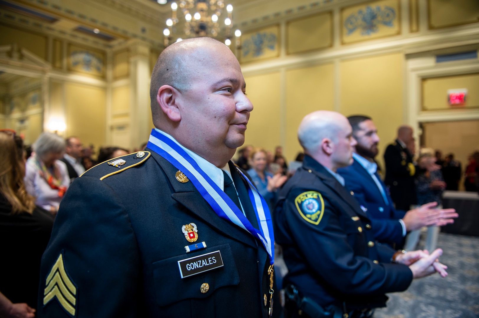 Oklahoma Army National Guard Sgt. Pedro Gonzales III stands with Oklahoma City Police Department Officer Zachary Barby and Tulsa Police Department Officer Aurash Zarkashan during an awards ceremony at the Oklahoma State Capitol in Oklahoma City, May 18, 2021. Oklahoma Governor Kevin Stitt presented Gonzales with the inaugural Oklahoma Medal of Valor, the state of Oklahoma’s highest award of honor presented to a member of a public safety agency or the public for heroic acts. (Oklahoma National Guard photo by Anthony Jones)
