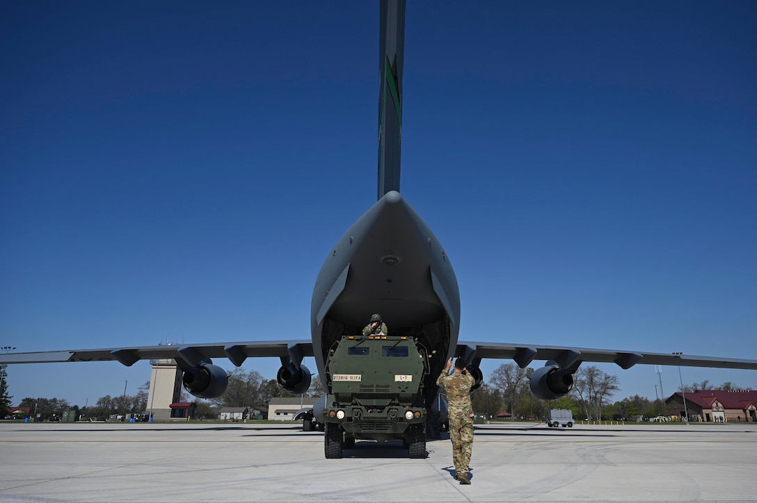 Airmen load an aircraft.