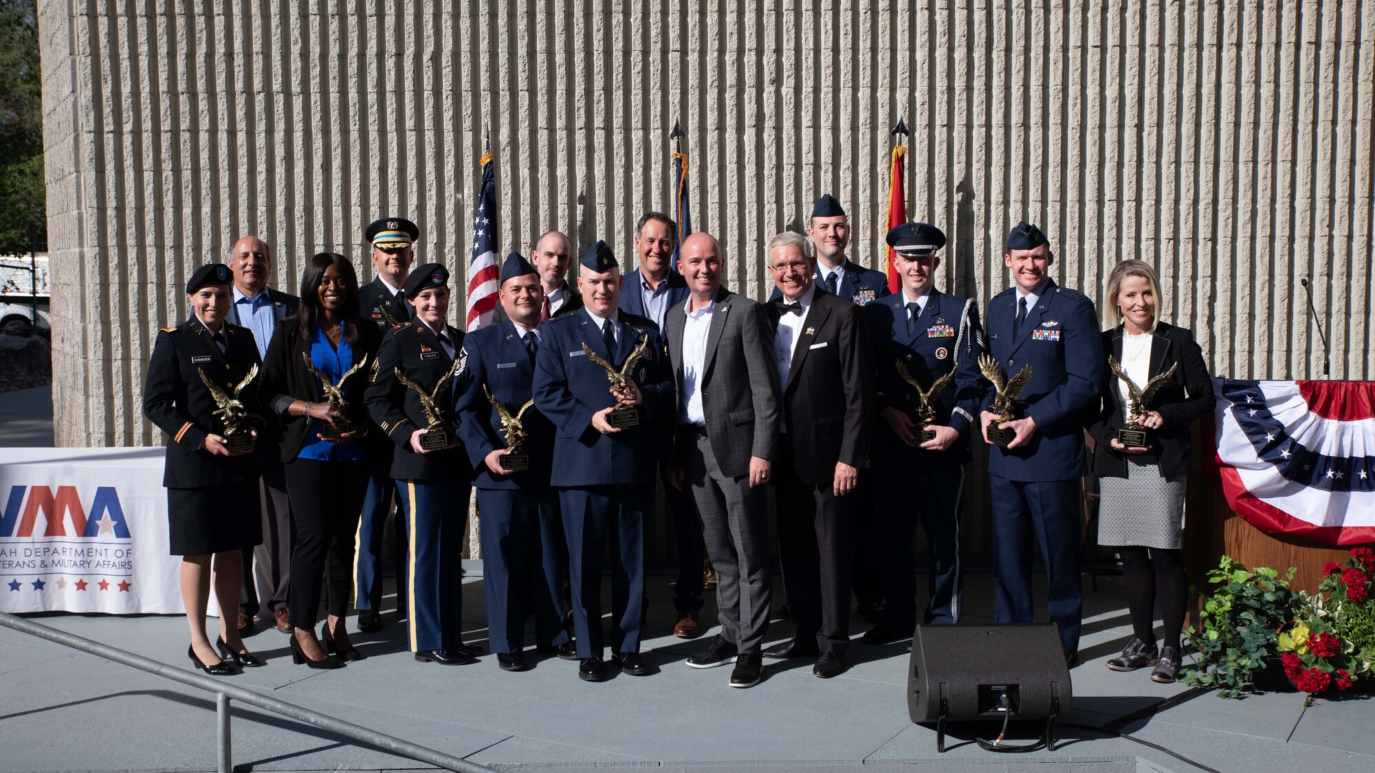 Recipients of the State of Utah Servicemembers of the Year awards pose for a group photo with Utah Gov. Spencer Cox.