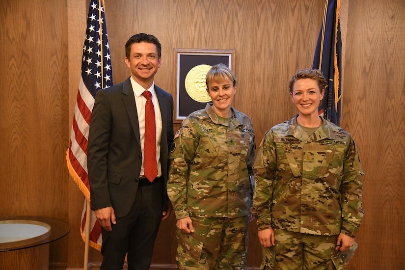 three soldiers pose for photo