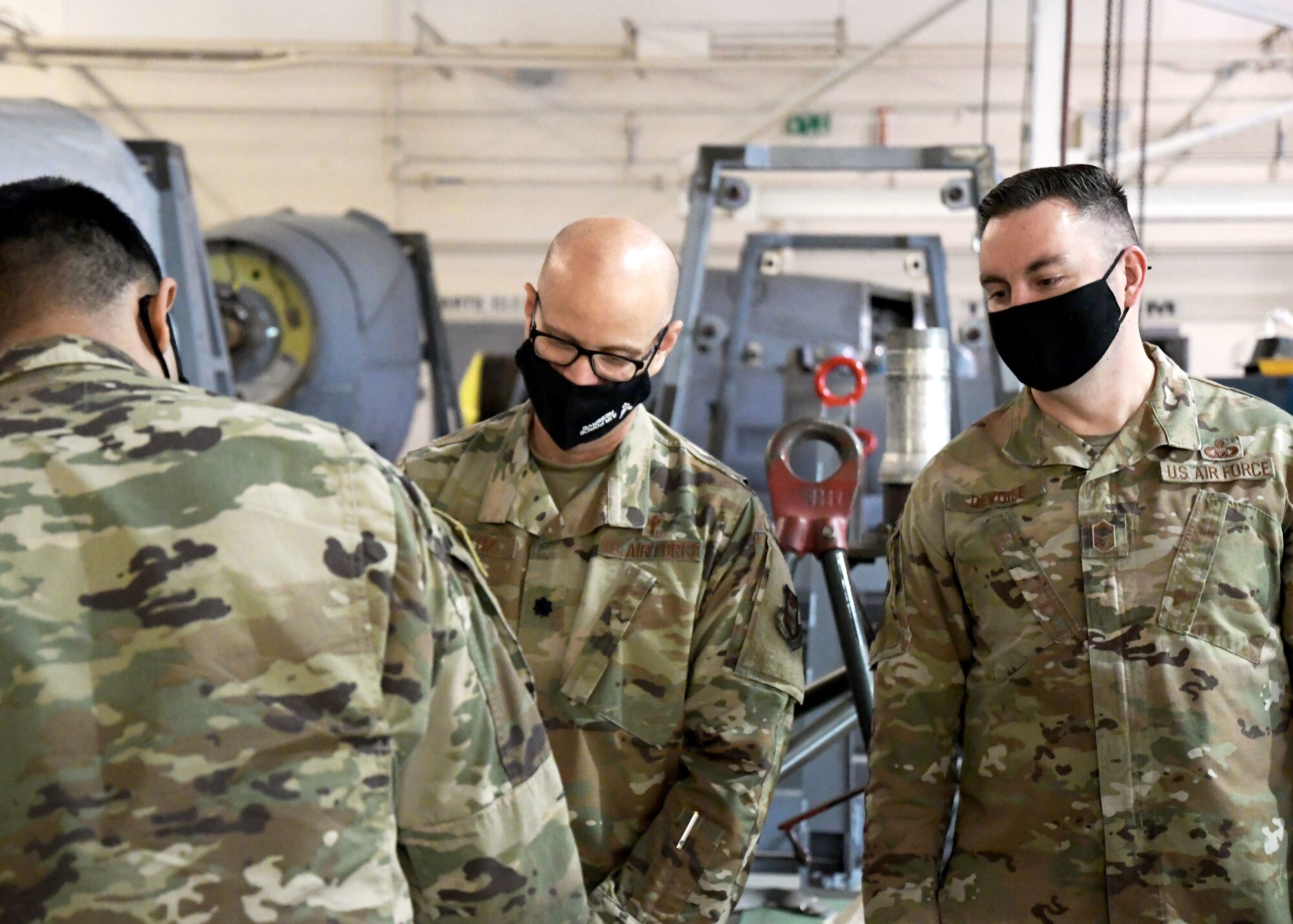 Lt. Col. Antonio Ortiz-Guzman, 94th Airlift Wing chaplain, and Senior Master Sgt. Anthony Devoile, 94th AW Religious Affairs superintendent, serve pizza to members of the 94th Maintenance Squadron during a luncheon on April 15, 2021, at Dobbins Air Reserve Base, Ga.