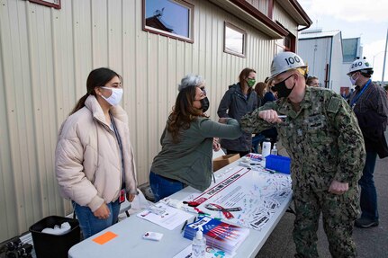 Puget Sound Naval Shipyard & Intermediate Maintenance Facility leaders and employees signed C.A.R.E. pledges and banners during two events May 18, 2021, at locations throughout the shipyard in Bremerton, Washington.