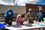 Puget Sound Naval Shipyard & Intermediate Maintenance Facility leaders and employees signed C.A.R.E. pledges and banners during two events May 18, 2021, at locations throughout the shipyard in Bremerton, Washington.