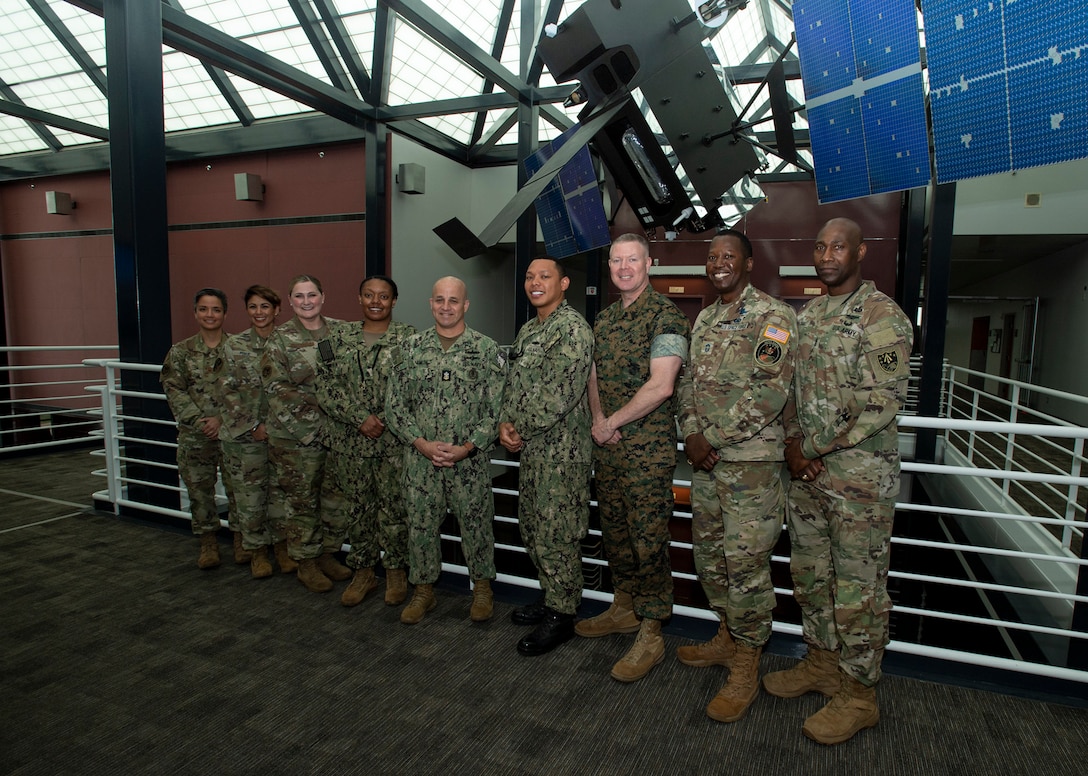 Military officials pose for a photo.